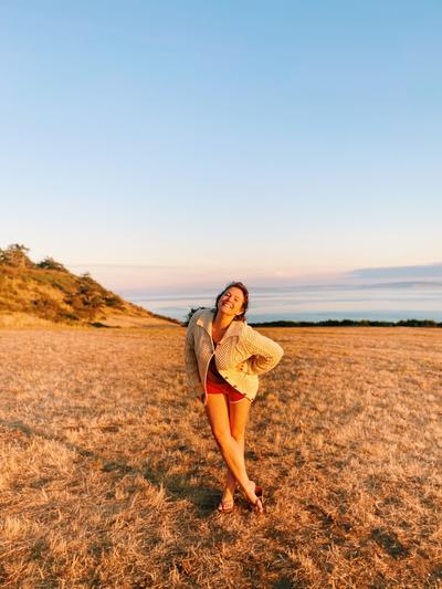 CaitlinStandingSmilingInPerfectLightCamping