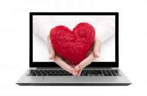 bigstock-Laptop-with-red-heart-in-woman-48699554-300x196