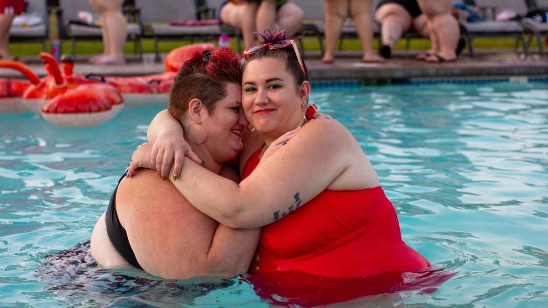 two-women-hugging-in-swimming-pool-edited