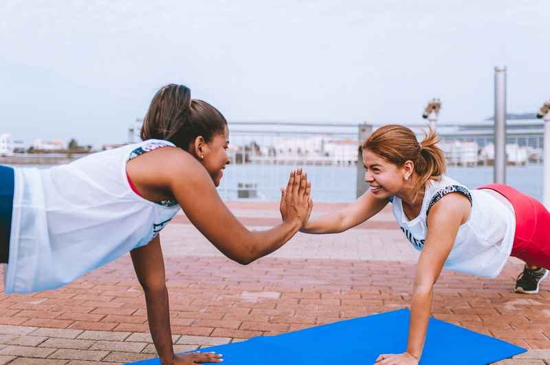 fitness-two-diverse-woman-doing-exercise