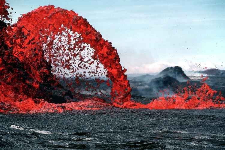 red hot spewing magma bursting volcano