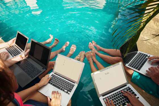 shutterstock_group_laptop_pool_party