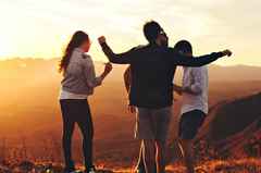 people-friends-dancing-during-sunset