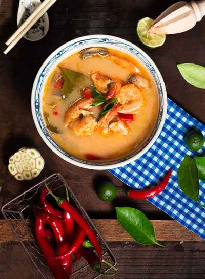 shrimp-soup-in-white-ceramic-bowl-with-chili-on-brown-wooden-1437590-4