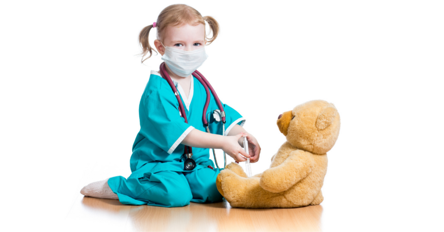 child giving teddy bear a needle