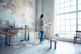 artist woman studio easel window