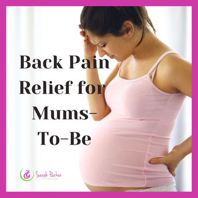 Pregnant woman holding lower back, representing online class for back pain relief during pregnancy