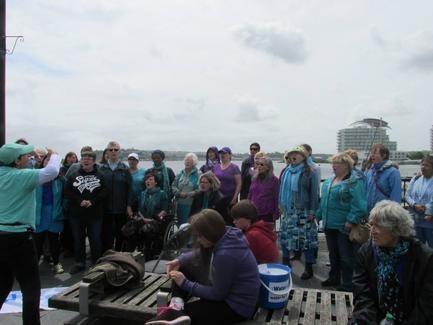 Rebecca conducting at Cardiff Bay