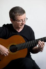 Rebecca Ballard playing the guitar