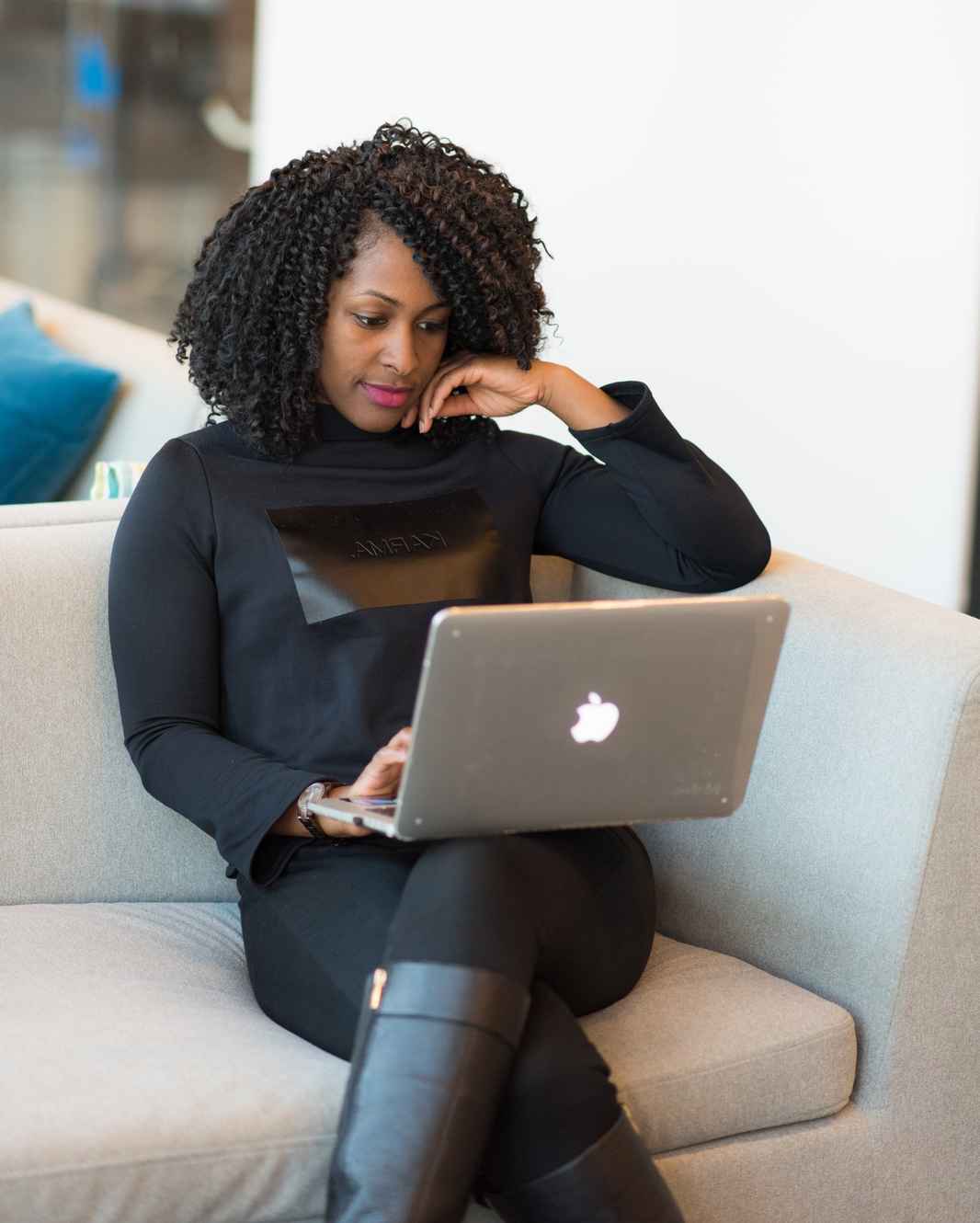 Woman in boots on computer