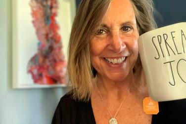 Carolyn Dragon with spreading Joy mugg