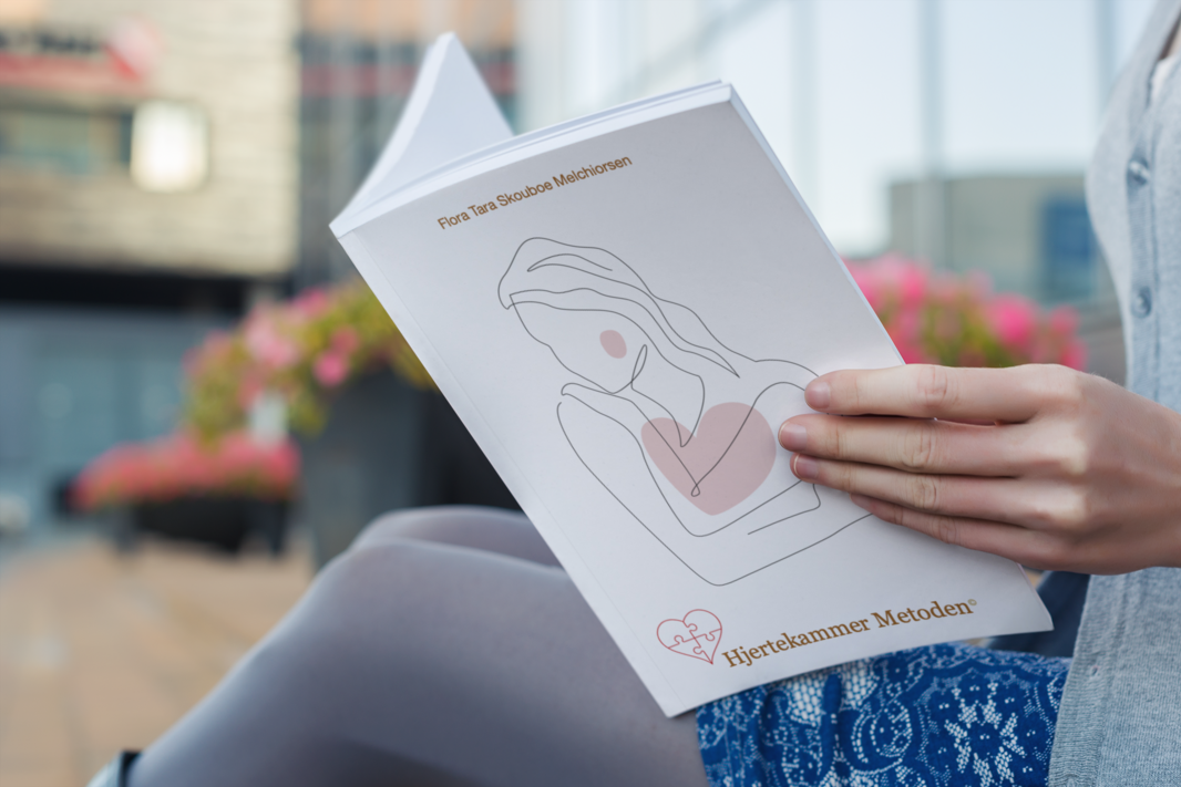 mockup-of-a-woman-reading-a-softcover-book-3418-el1