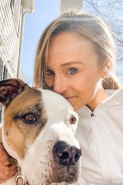 Dr. Amelia Knight Pinkston with her tan and white dog Jameson