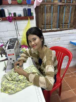 Cambodian Girl Sewing