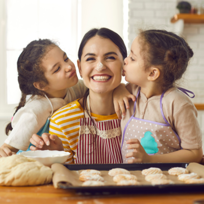Mom baking with daughters