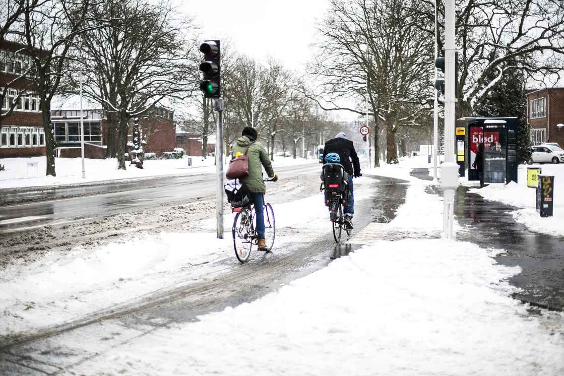 Foto Cyklister i snevejr