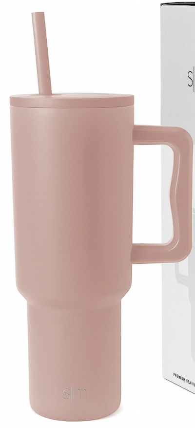 tall soft blush colored cup with handle and straw