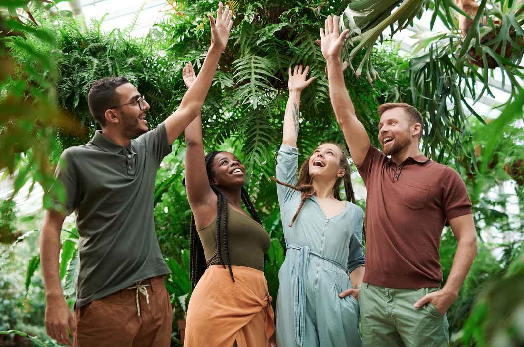 people-group-of-diverse-women-and-men-raising-their-hands